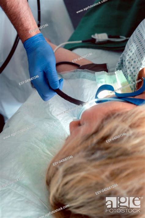 Doctor Inserting Camera Of Endoscope During Gastroscopy In Mouth Of
