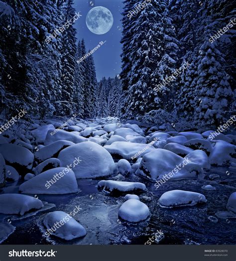 Winter Night Scenery With Mountain River Stock Photo