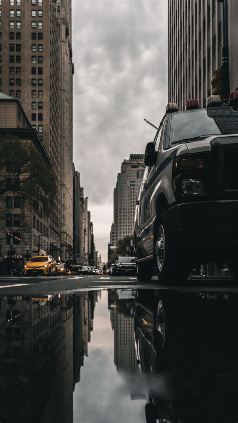 Download Wallpaper 2160x3840 Street Puddle Reflection Cars