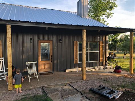 This one story glass house features open floor plan and floor to ceiling glass walls between black steel piers and stock h beams. Wrapping the steel beams on the front porch this morning ...
