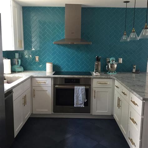 I'm in a dilemma, i want teal kitchen cabinets in particular cascades by sw. Amazing kitchen! Teal herringbone backsplash, white ...