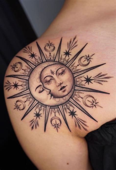 A Woman S Stomach With A Sun And Moon Tattoo On The Back Of Her Shoulder