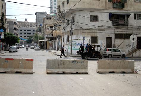 Rockets fired from gaza city are seen streaming towards israel this morning as the two sides pictured: MIDEAST-GAZA CITY-COVID-19-LOCKDOWN
