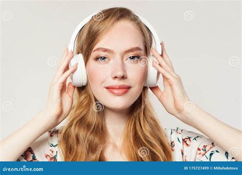 Girl With Headphones Woman Listening Music On White Imagen De Archivo