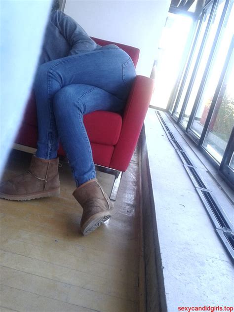 Hot Candid Girl Sitting On A Couch With Crossed Legs Sticking Out Her
