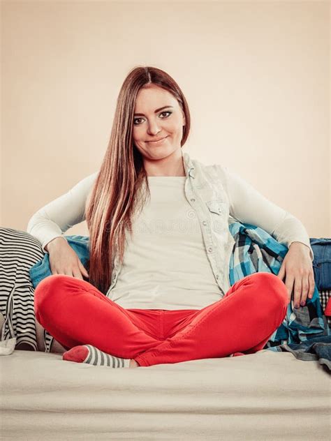 Happy Woman Sit On Sofa Full Of Clothes Stock Image Image Of Hard Style 70366609