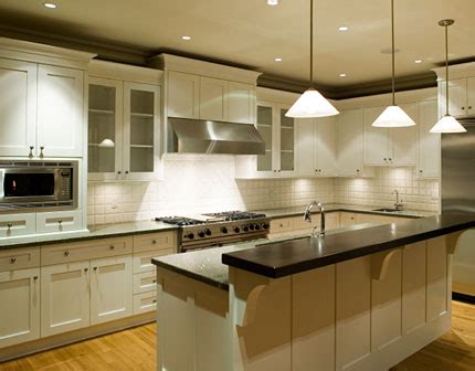 The blue and green backsplash enhances the room's coastal charm. Cabinets for Kitchen: White Kitchen Cabinets - Design