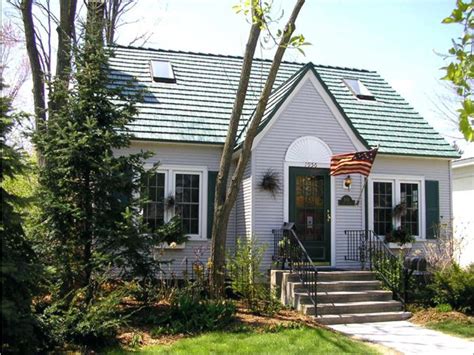 The best grey paint matches the room's light, size and use. Green roof with classic exterior style and paint scheme ...