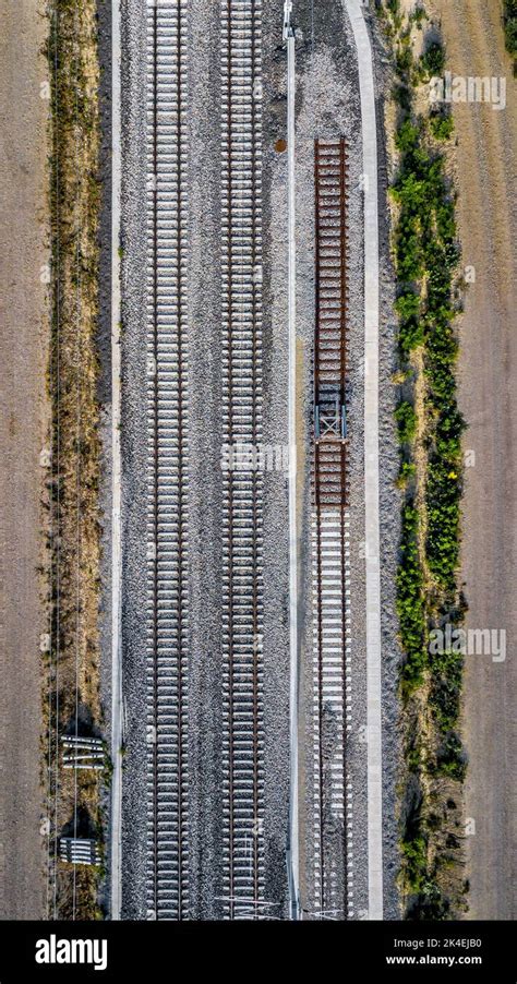 Aerial View Of Railroad Tracks And Gravel Roads In Rural Landscape With