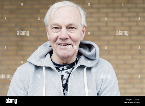 Man Wearing Hooded Top Looking At Camera Smiling Stock Photo Alamy
