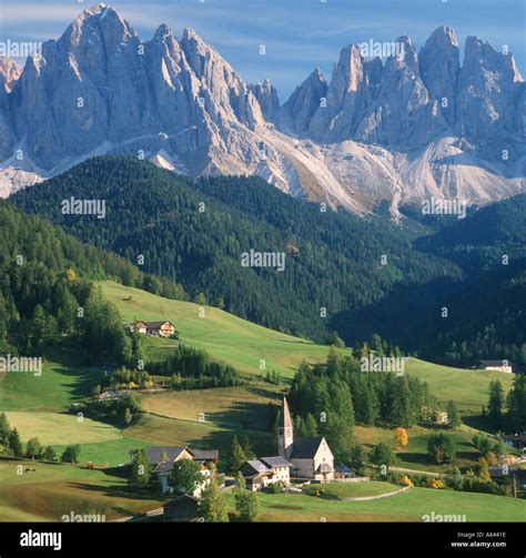 Alpine Church And Village Funes In Dolomite Mountains Of Italy Stock
