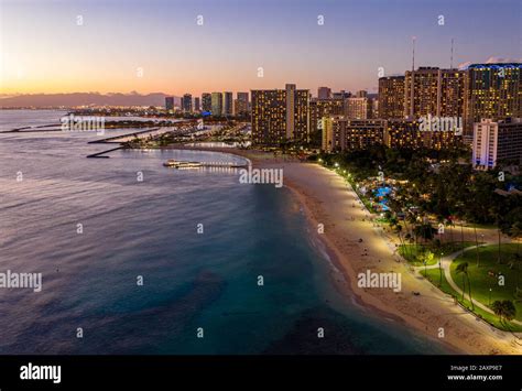 Aerial Panorama Of Waikiki Beach And Honolulu On Oahu Hawaii At Sunset