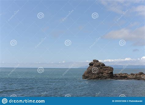 Picturesque Seashore With Rocks And Beach On A Sunny Day With Clear