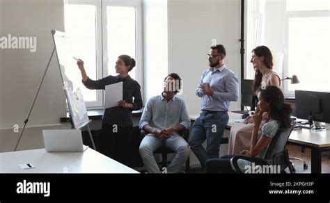 Indian Woman Trainer Coach Hold Flipchart Presentation Teach