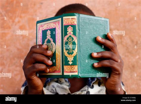 Young African Boy Reading The Koran Stock Photo Alamy