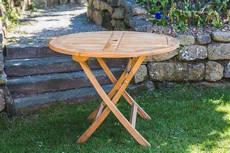 It is a fabulous table, somehow it seems perfect for four but at a squeeze you can fit ten people round it. Circular Teak Folding Garden Table 1m | Folding garden ...