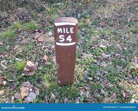 Mile Marker 54 Or Post In Ground With Grass Stock Image Image Of