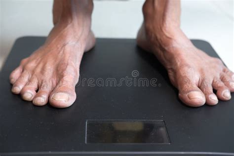 Senior Womenand X27s Feet On Weight Scale Close Up Stock Image Image