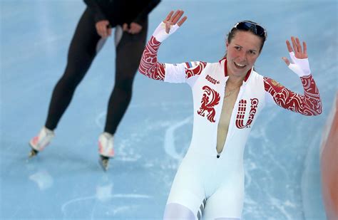 Olga Graf Of Russia Waves After Her Womens 3000 Meters Speed Skating Race During The 2014 Sochi