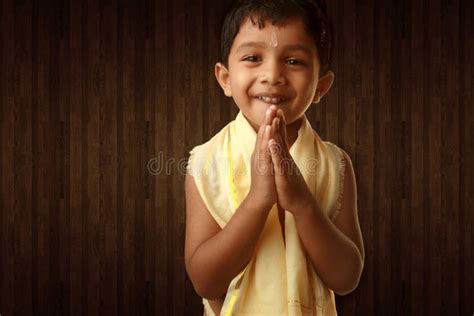 A Kid Greets With Folded Hands Royalty Free Stock Images Image 15779569