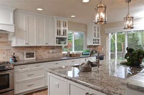 The painted cabinets are holding up very well. Giallo Imperial Granite - Stone Culture