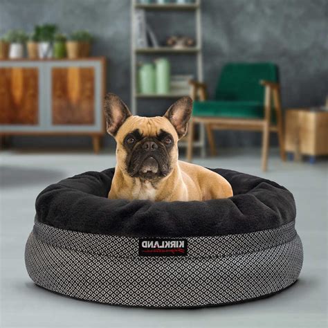 A dog bed provides warmth, reassurance and a sense of security to your dog. NEW Kirkland Signature 24" Nest Dog Bed, Navy