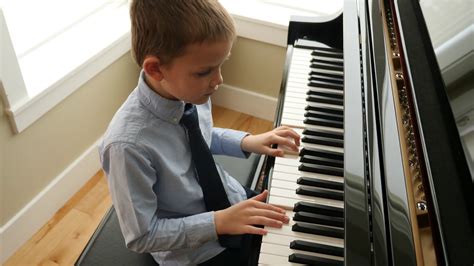 A Charming Child Performs Piano At Home Stock Footage Sbv 338133994