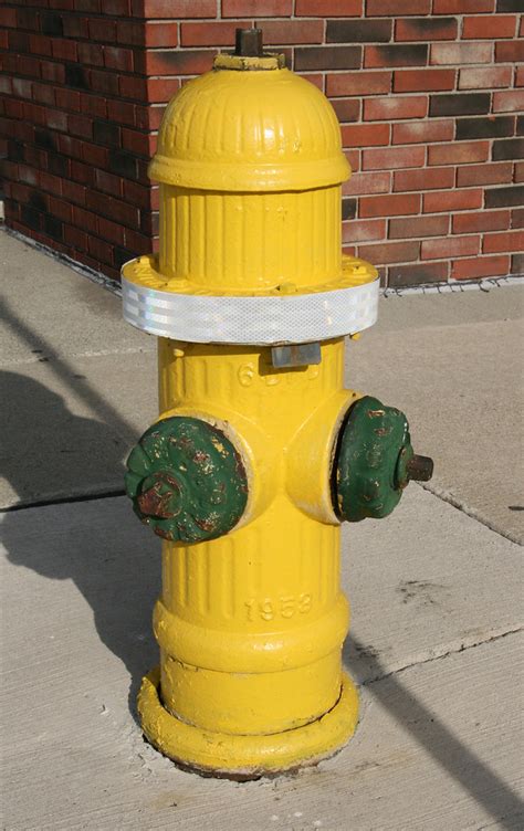 Deland florida usa a fire hydrant for use by the fire department on the corner of a street. 1953 Fire Hydrant | Yellow fire hydrant with green nozzles ...