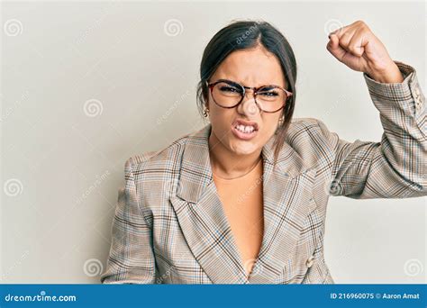 Young Brunette Woman Wearing Business Jacket And Glasses Angry And Mad