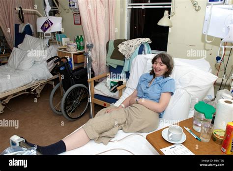 Woman Lying On Nhs Hospital Bed Of Having Had An Amputation Of The Left