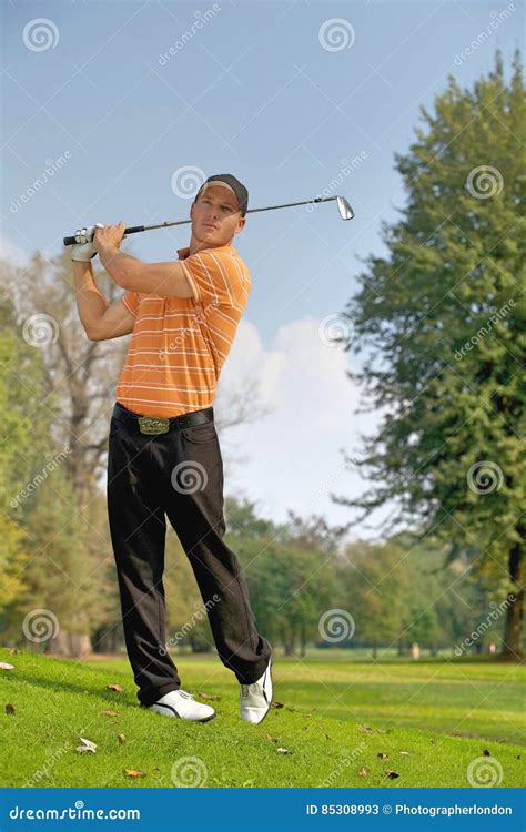 Young Man Swinging Golf Club Stock Image Image Of Hobbies