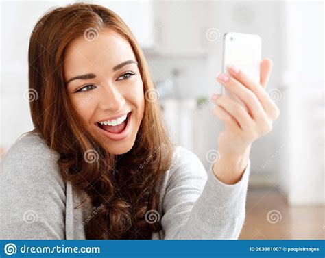 woman taking selfie on mobile phone communication with people on social media and relax with