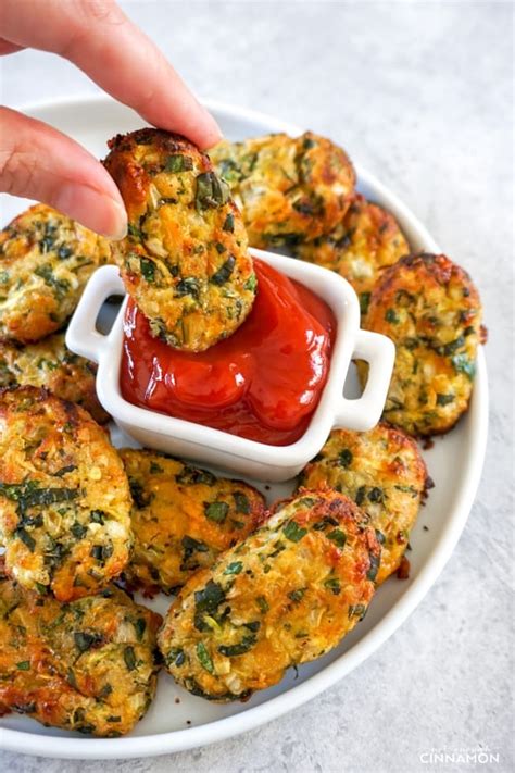 Arrange in a single layer on a greased baking sheet or shallow baking dish; Cheesy & Healthy Zucchini Tots Recipe - Not Enough Cinnamon