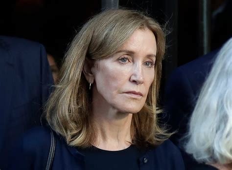 felicity huffman reports to prison for two week sentence after college admissions scandal
