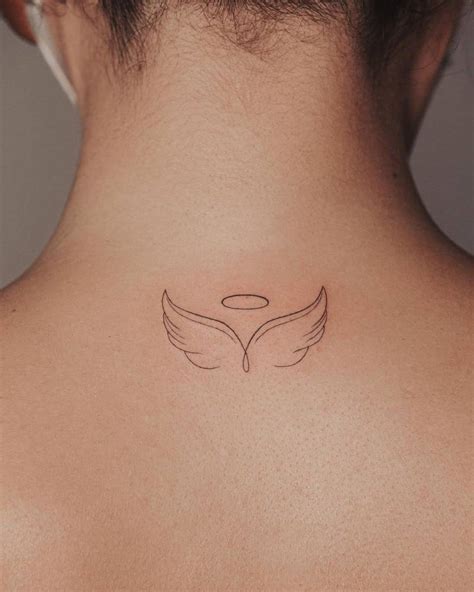 Minimalist Angel Wings Tattoo On The Upper Back