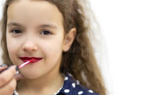 Beautiful Young Girl Putting On Red Lipstick Stock Photo Image Of