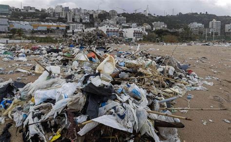 Widespread Waste Cleanup Underway As Garbage Blankets Beirut Beach