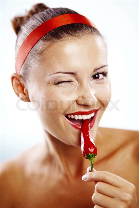 Beautiful Woman With Red Lips Holding Chilli Pepper Stock Image