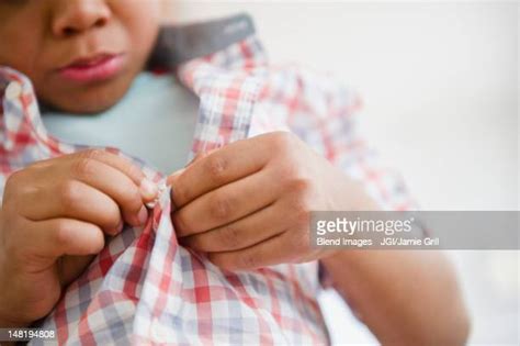 Child Buttoning Shirt Photos And Premium High Res Pictures Getty Images