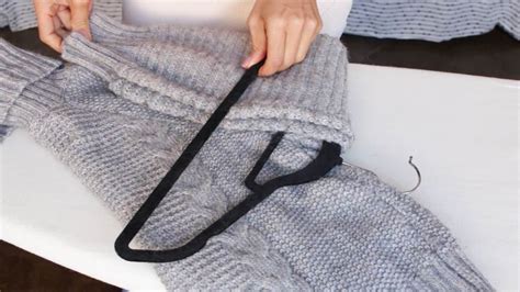 How To Hang Your Sweaters Without Ruining Them Sweater Hanging