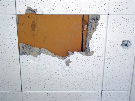 Precautions for safely removing asbestos popcorn ceiling remove furniture from the room, and cover whatever is left in the room with plastic. Damaged Asbestos Ceiling Tile | Flickr - Photo Sharing!