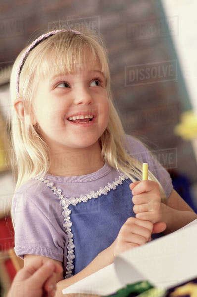 Girl In Classroom Stock Photo Dissolve