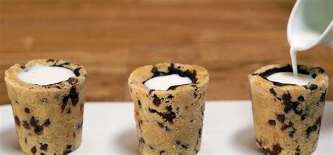 three cookies cups with milk being poured into them and the words milk and cookie shots written