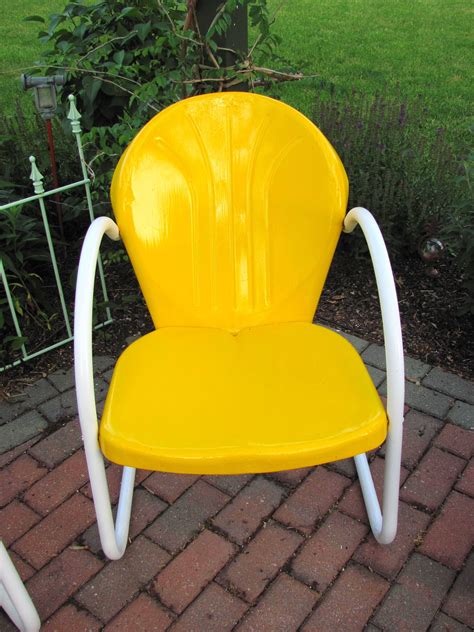 Queensbury set of 2 antique metal frame swivel rocking chair (s) with spectrum sand sunbrella slat seat. Yellow | Lawn furniture