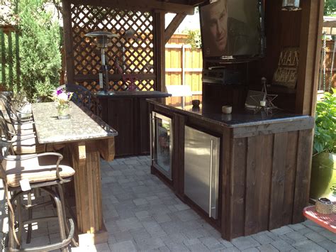 This cabinetry will not split, fade, crack, or chalk. Custom Outdoor bar with granite tops and Cedar cabinets ...