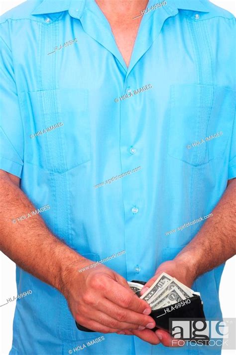 Mid Section View Of A Man Taking Out Money From A Wallet Stock Photo