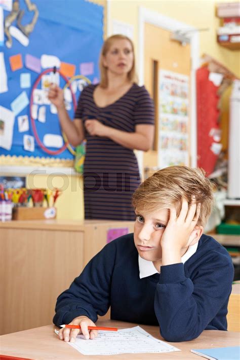 Male Elementary School Pupil Struggling In Class Stock Image Colourbox