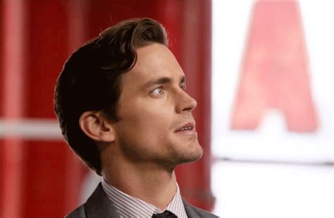A Man In A Suit And Tie Looking Off Into The Distance With His Eyes
