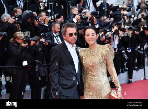 Chinese Actress Gong Li Right And Her Husband Jean Michel Jarre Pose As They Arrive On The Red
