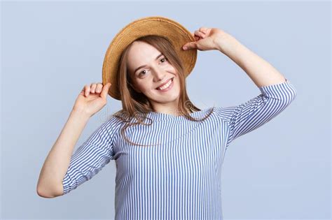 Headshot Of Adorable Pretty Young Woman Wears Straw Hat And Striped